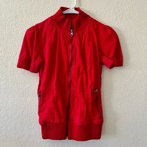 Red zipped up top